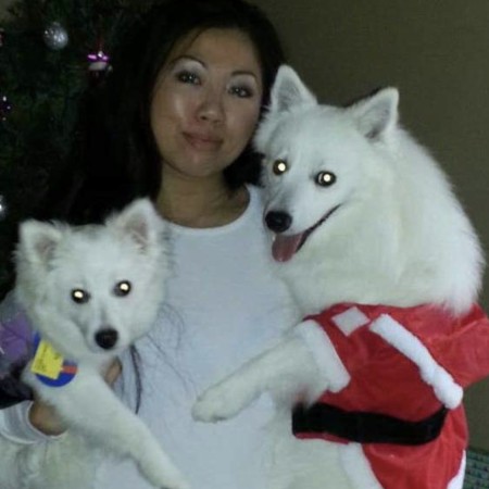 Left to right: Victoria (white dog), Wendy Lam, and Pikachu (dog that passed away)